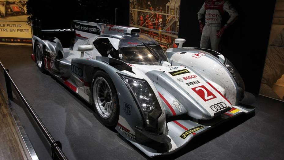 Audi R18 e-tron (2013) | <a href="https://gutenberg.quatrorodas.abril.com.br/noticias/saloes/genebra-2014/salao-genebra-exibe-bolidos-le-mans-775992.shtml" rel="migration">Leia mais</a> | <a href="https://gutenberg.quatrorodas.abril.com.br/noticias/saloes/genebra-2014/" rel="migration">Confira tudo sobre o S</a>