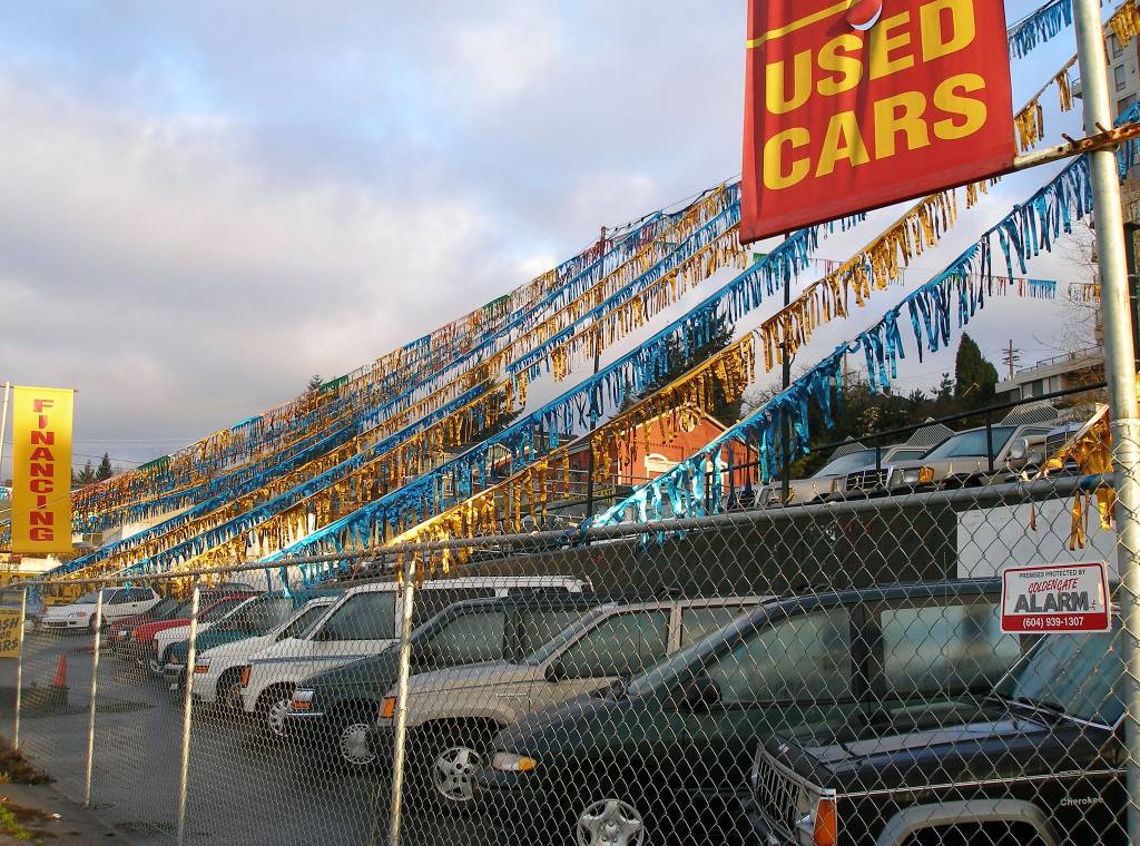 Old cars wait for buyers on 12th Street. Old cars wait for buyers on 12th Street.